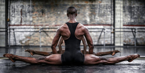 "A male dancer performing a mid-air leap, his body extended and arched in a display of impressive flexibility. This black and white photograph is titled 'Creating Space' and is available as a premium-quality print on archival paper from iDanceContemporary.gallery."