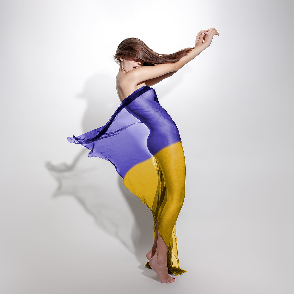 Stand for Ukraine; Model covered with Ukraine flag - buy the photo as print and all the money will go to help the refugees