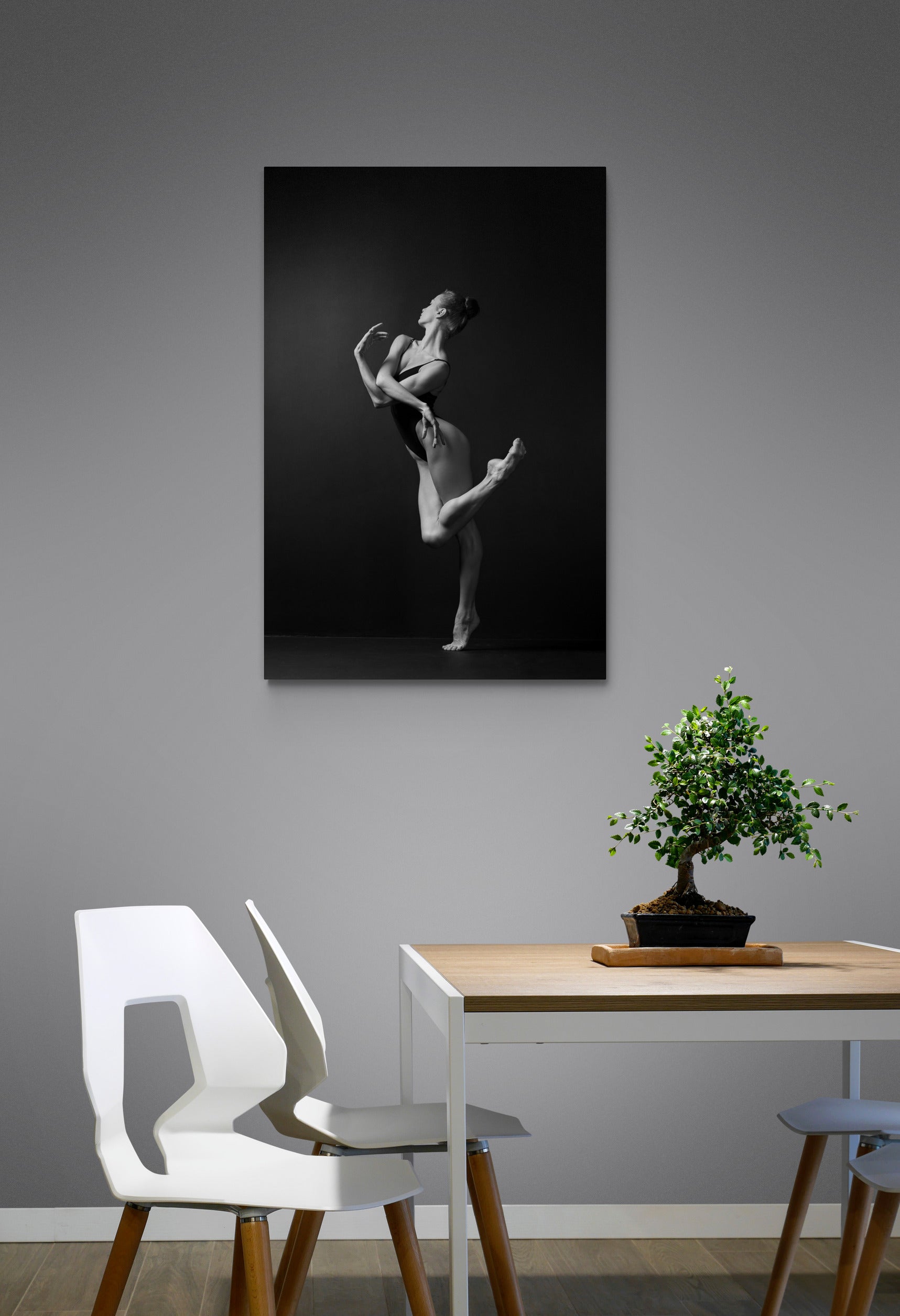 Artwork on the wall, dining room. Ballerina, bodysuit, graceful dancing, black and white photography print. 