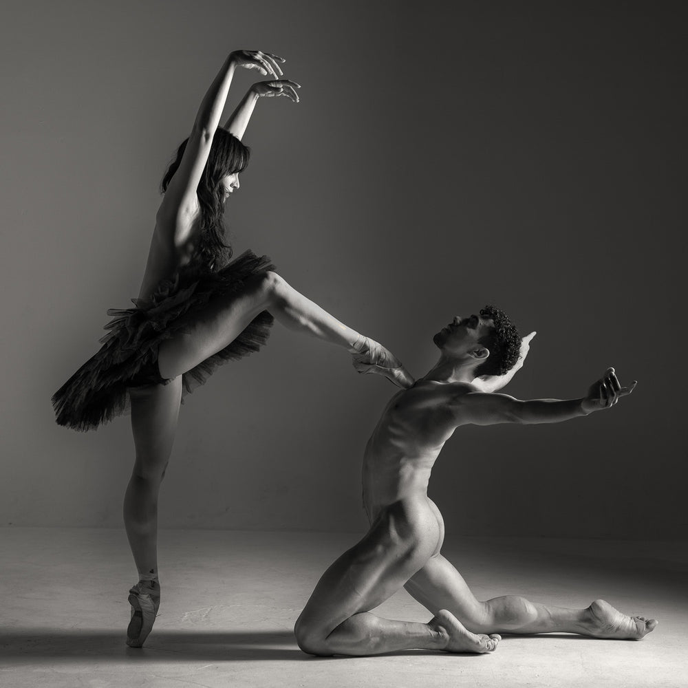 Dani and Emanuel #3 fine art dance print by E.E. McCollum, a black-and-white composition capturing the elegance and dynamic connection of two dancers in motion.