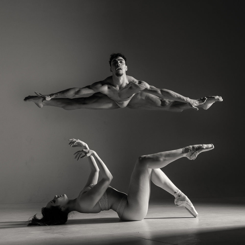 Dani and Emanuel #5 fine art dance print by E.E. McCollum, a black-and-white composition capturing balance, strength, and connection, perfect for modern interiors and art collectors.